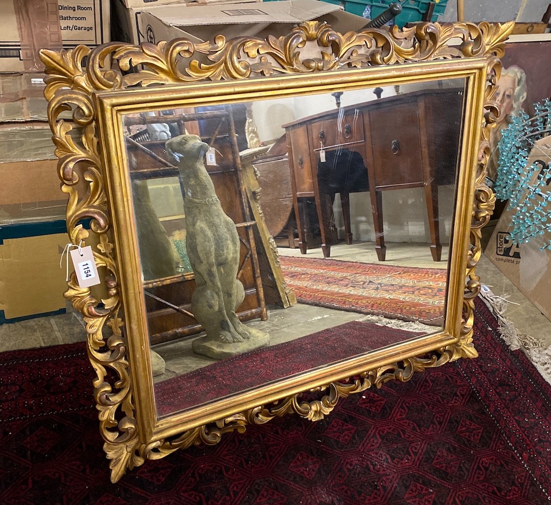 A rectangular carved giltwood Florentine style wall mirror, width 96cm, height 84cm